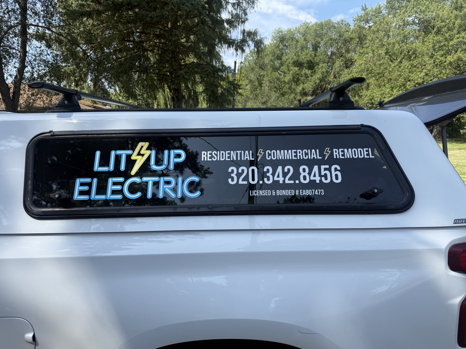 Lit Up Electric truck with neon logo — Residential, Commercial, Remodel — 320.342.8456